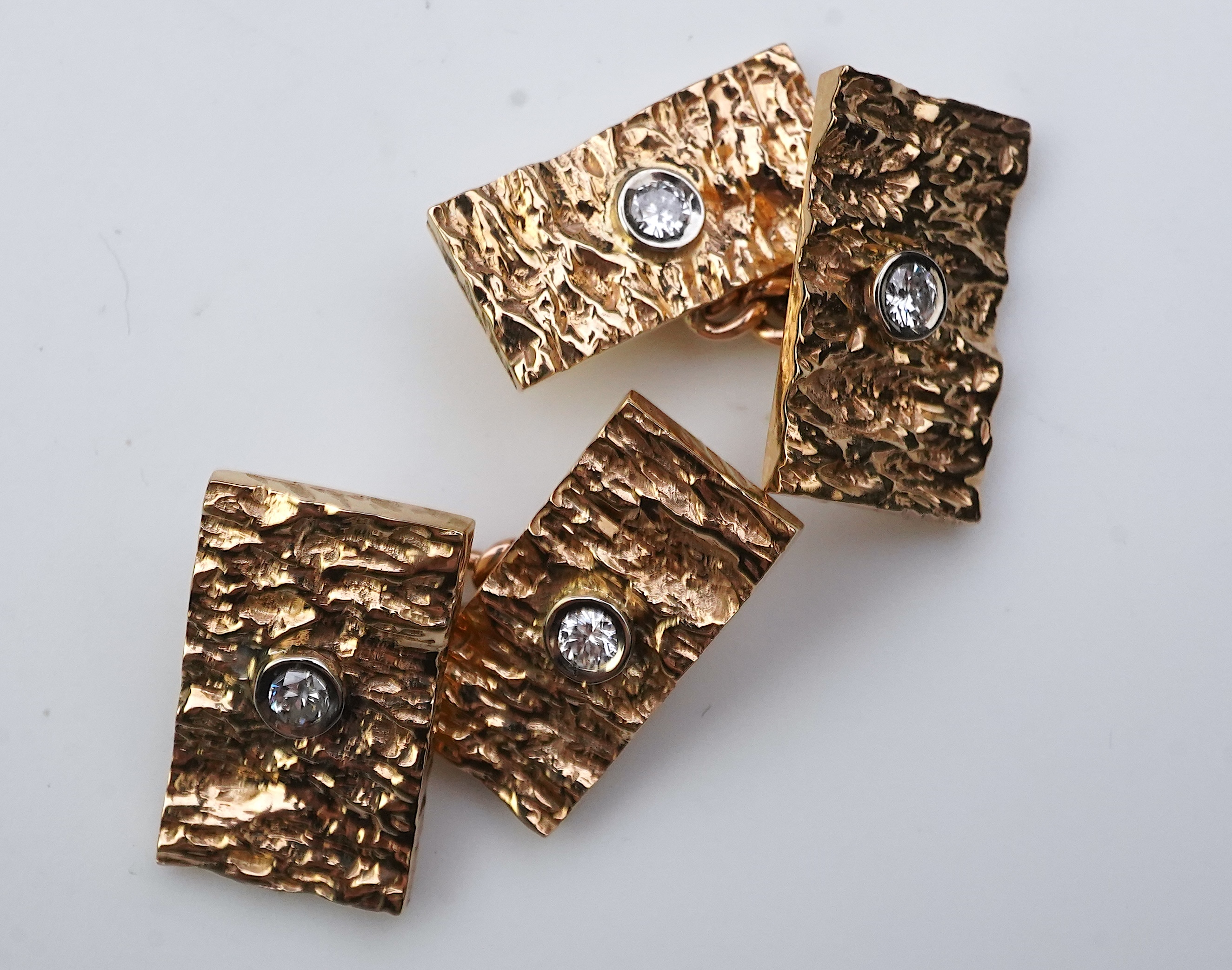 A pair of 9ct gold and diamond cufflinks, 1970s